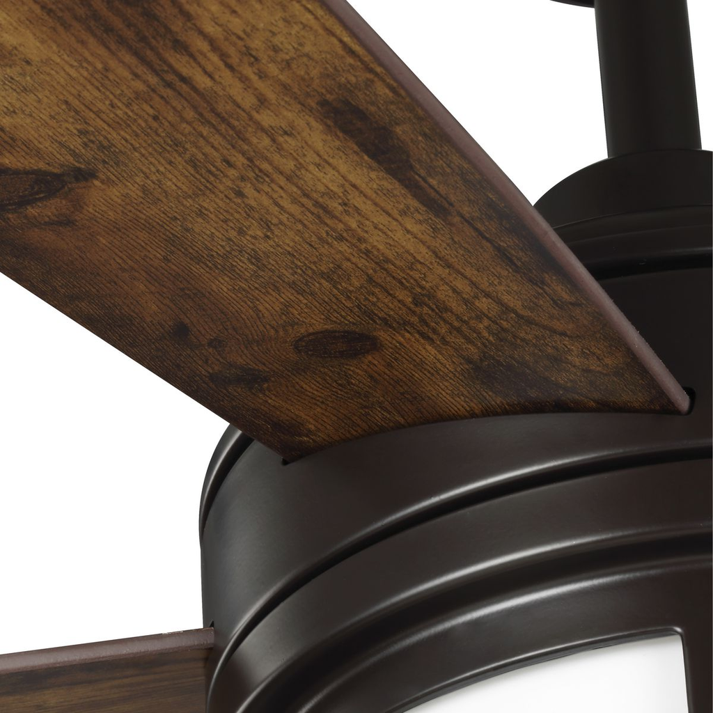 Architectural bronze-finished ceiling fan with white opal shade.