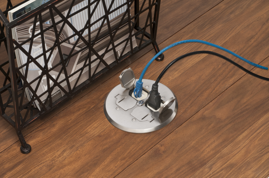 A combination floor box kit with installed low voltage devider. Includes four flip lids and gasket, One low voltage device and one 110v receptacle. Round Nickel Plated Cover.